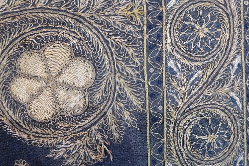 An Indian needlework panel, the black fabric decorated with gold coloured thread depicting a - Image 3 of 3