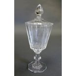 An armorial glass goblet and cover, with faceted bowl on a knopped stem and octagonal foot,