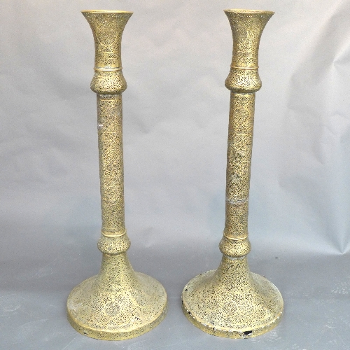 A pair of late C19th mammoth sized pierced brass mosque lampstands, the allover intricate