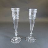 A pair of C19th oversized champagne flutes, the conical bowls with engraved band decorated with