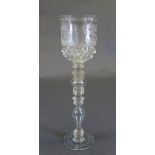 An C18th engraved glass goblet, the bucket form bowl with engraved detail of a huntsman in a