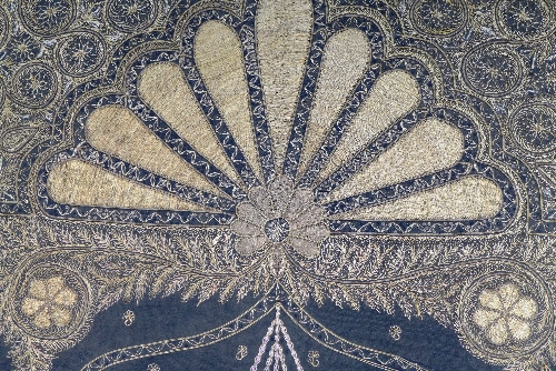 An Indian needlework panel, the black fabric decorated with gold coloured thread depicting a - Image 2 of 3