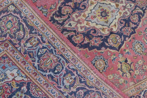 A Kashan rug, the cerise ground with indigo and ivory lobed pole medallion enclosed by similar - Image 3 of 3