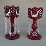 A near pair of Victorian ruby glass lustres, the gilt scalloped rim with foliate swag detail, fitted