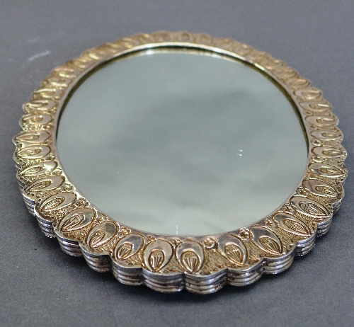 A Turkish white metal mirror, the embossed oval shaped back with central bouquet design within - Image 2 of 2