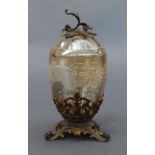 A C19th Bohemian amber glass lidded urn, the ovoid body with overlaid white floral decoration