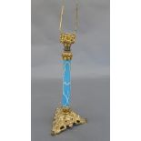 A C19th column form blue glass and ormolu table lamp, the blue glass column with white tracery