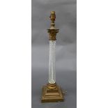 A C19th glass and gilt metal column lamp, the Corinthian gilt metal capital on spiral twist column