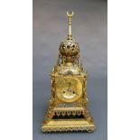 A late C19th Islamic design brass mantel clock of temple form, having bell strike movement within