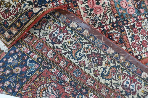 A hand woven Bakhtiari Persian carpet, the field with polychrome compartments enclosing floral - Image 3 of 3