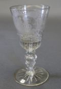 A late C18th Dutch glass goblet, the tapering bowl having copper wheel engraved scrolling leaf