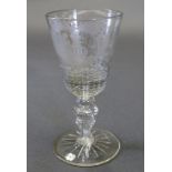 A late C18th Dutch glass goblet, the tapering bowl having copper wheel engraved scrolling leaf