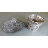 A Persian silver bucket having filigree decoration and swing handle with repeating floral