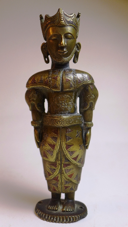 A bronze C19th figure of a King, probably Indian, the bearded and crowned figure attired in costume