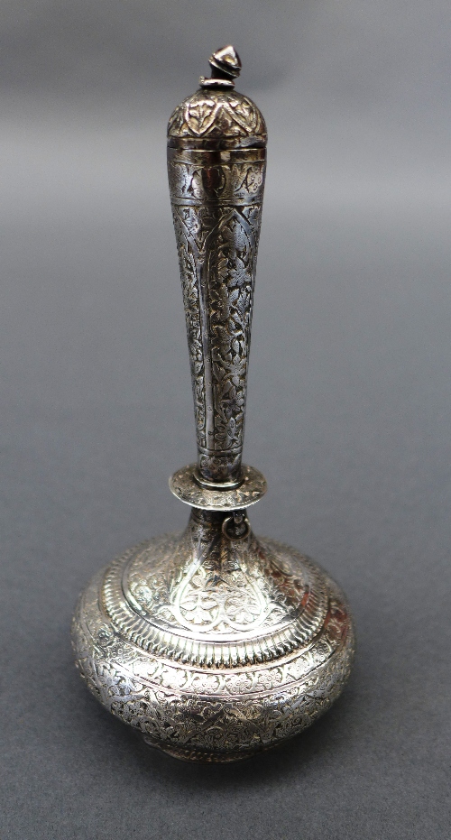 A Kashmiri silver vase and cover with allover flower and vine details (116.5 g). Height 17 cm