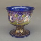 A C19th Venetian blue glass tazza, the circular bowl with hand painted band depicting hunting and