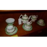 A C19th part tea set decorated with green border and gilding including a tea pot, sucrier ( no lid )