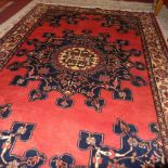 A fine North West Persian Tafresh rug, 203cm x 133cm, central pendant medallion on a rouge field