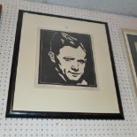 A glazed and framed linocut portrait of a man by Ernst Hase signed in pencil