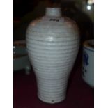 A Chinese baluster form vase with white glaze