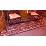 A Persian hand knotted Baktiar carpet the rouge field with repeating multicoloured geometric