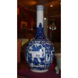 A Chinese blue an white Kang Xi spill vase decorated with dragons