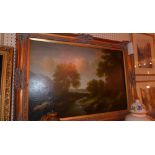 An oil on canvas Continental landscape scene in an ornate gilt frame