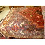 An extremely fine South West Persian Qashgai carpet bearing triple pole medallion with repeating