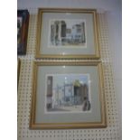 A pair of John Ash watercolours of Hastings and a Brighton street signed in gilt frames