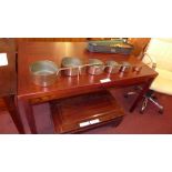 A C1960`s faux rosewood veneered extending dining table of rectangular form raised on square