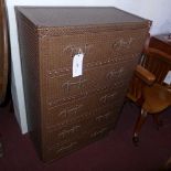 A contemporary tall chest of shallow depth fitted five drawers clad in woven leather with strap