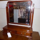 A C19th mahogany swing frame dressing mirror with bevelled plate and two drawers