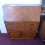 A Danish style teak bureau of narrow proportions fitted fall front two drawers and pair of panel