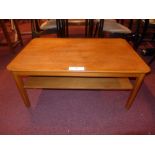 A pair of Danish style teak two tier low tables