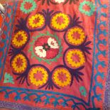 Two Uzbek Suzani, one is a pelmet, deep rose pink cotton ground, 472cm x 71cm, embroidered in