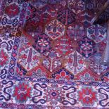 A fine North West Persian Baktiar carpet, 320cm x 205cm, repeating garden motifs on a terracotta