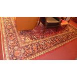 A fine central Persian Kashan carpet, 320cm x 245cm, central pendant floral motifs with repeating