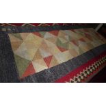 A Persian Shiraz hand woven contemporary runner with repeating multi-coloured geometric design