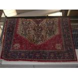 A good hand woven Abadeh Persian carpet, with a central hexagonal ivory field and floral