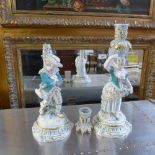 A pair of porcelain candlesticks in the form of ladies (a/f)