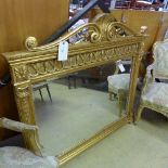 A large giltwood overmantle mirror