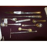 A small collection of hallmarked silver including a food pusher, cake knife, mustard spoon and