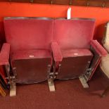 A pair of vintage cinema seats in red velour