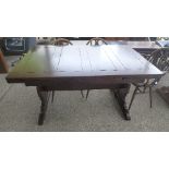 An oak draw leaf 1950's dining table and a set of five Ercol chairs