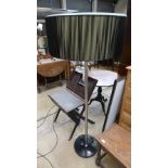 A chrome standard lamp on marble base with matching shade