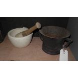 A C19th cast iron mortar with a C19th stoneware pestle and mortar