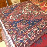 A fine old North West Persian Bakhtiar rug (195 cm x 125 cm) central floral pendant medallion on a