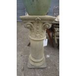 A pair of reconstituted stone classical style pedestals