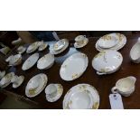 A cream petal dinner service with floral decoration