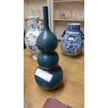 A dark turquoise triple gourd Oriental vase